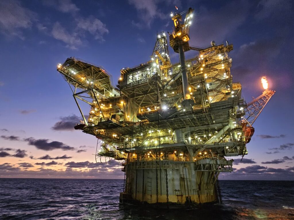 Offshore oil and gas platform at dusk